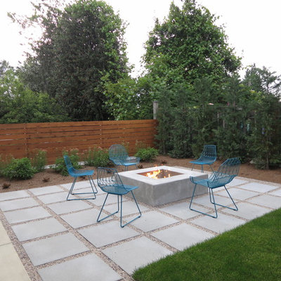 Patio - contemporary backyard concrete paver patio idea in Seattle with a fire pit