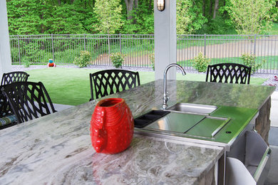 Inspiration for a back patio in Grand Rapids with an outdoor kitchen.
