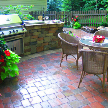 Grill station and wooded outdoor living space.