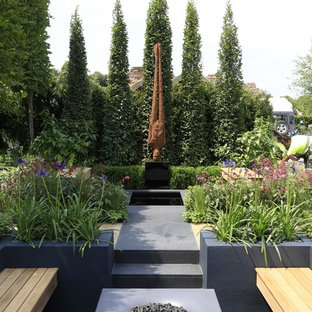 Design ideas for a contemporary patio in Berkshire with a fire feature and no cover.