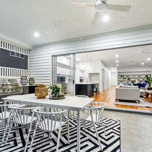 Contemporary patio in Brisbane with an outdoor kitchen and a roof extension.