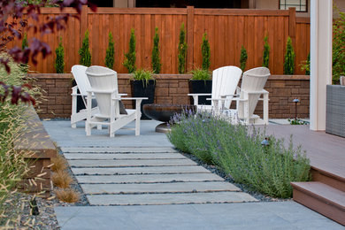 Patio - contemporary backyard patio idea in Boise with a fire pit