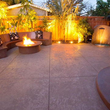 Hawaiian-Style Decorative Concrete Patio w/ Waterfall, Fire Pit & Bench Seating