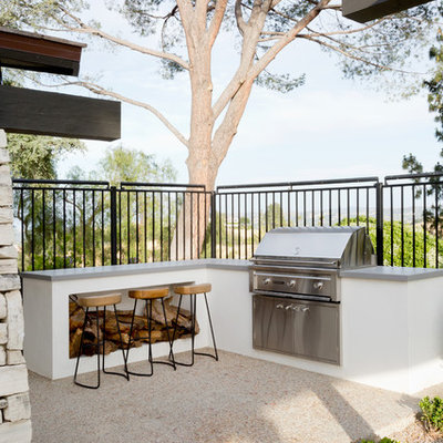 Inspiration for a 1960s backyard concrete patio remodel in Los Angeles with no cover