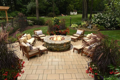 Patio - mid-sized transitional backyard concrete paver patio idea in Other with a fire pit and no cover