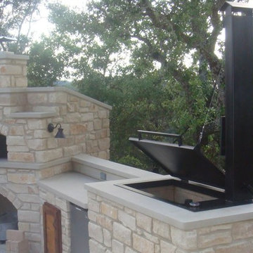 Hill Country Outdoor Kitchen Features Smoker and Pizza Oven