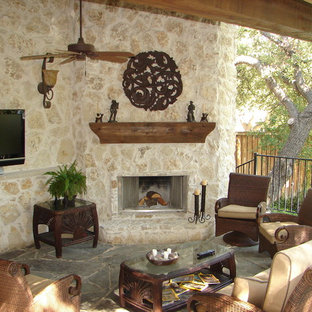 Elegant patio photo in Dallas with a fire pit and a roof extension