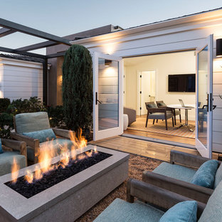 Patio - contemporary backyard gravel patio idea in Boise with a fire pit and no cover
