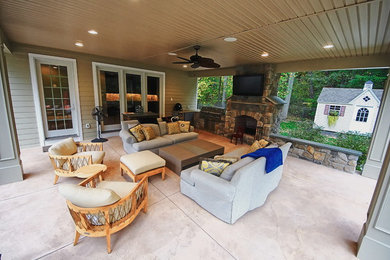 Patio - large traditional backyard patio idea in Philadelphia with a fire pit and a roof extension