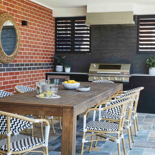 This is an example of a contemporary patio in Sydney with an outdoor kitchen and a roof extension.
