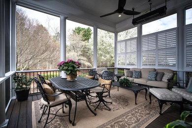 Photo of a medium sized traditional back patio in Other with decking and a roof extension.