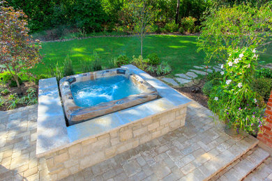 Example of a minimalist backyard patio fountain design in St Louis