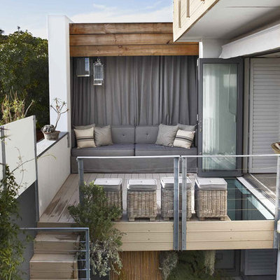 Example of a mid-sized trendy patio design in Other with decking and no cover
