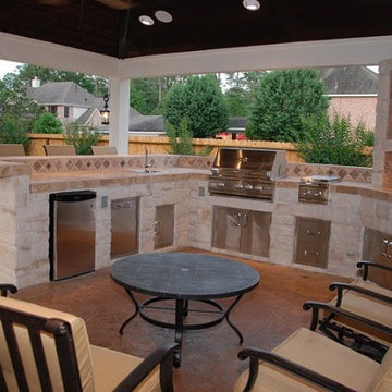 Houston outdoor kitchen, media room and bar with firepit