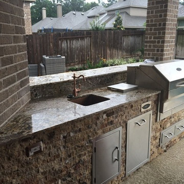 Houston Outdoor Kitchen With Traeger Grill and Scabos Split Face Stone