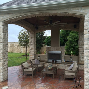 Houston outdoor sitting area with cool arches, warm fireplace
