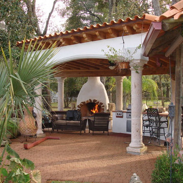 Houston Spanish style patio with fireplace and Mediterranean flair