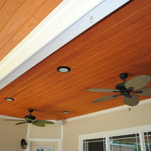 Patio kitchen - mid-sized traditional backyard stamped concrete patio kitchen idea in Houston with a roof extension