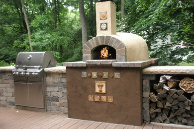 Inspiration for a mid-sized southwestern backyard patio remodel in Grand Rapids with a fire pit, decking and no cover