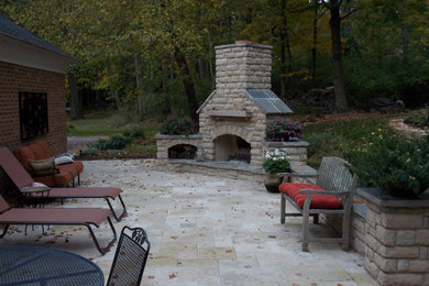 Foto de patio contemporáneo con adoquines de piedra natural