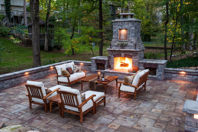 Inspiration for a backyard concrete paver patio remodel in Philadelphia with a fire pit and no cover