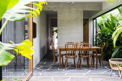 Photo of a world-inspired side patio in Sydney with a roof extension.