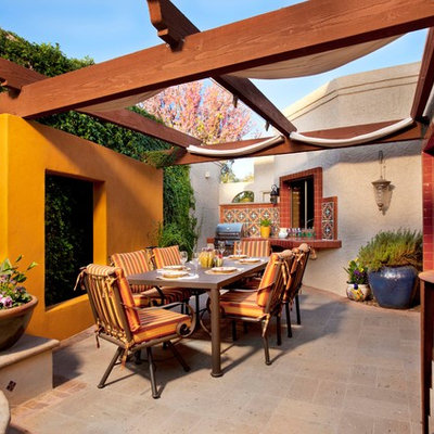Patio - mediterranean patio idea in Phoenix with a pergola