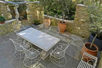 This is an example of a mediterranean patio in Sussex.