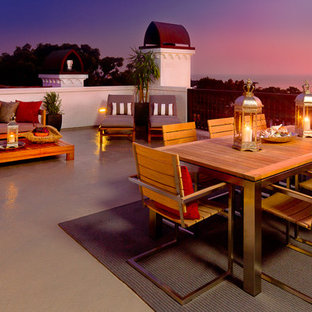 Patio - large modern concrete patio idea in Orange County with no cover