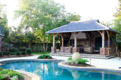 Patio kitchen - mid-sized traditional backyard brick patio kitchen idea in New Orleans with a gazebo