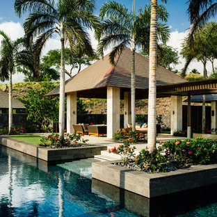 Patio - tropical backyard patio idea in San Francisco with a gazebo