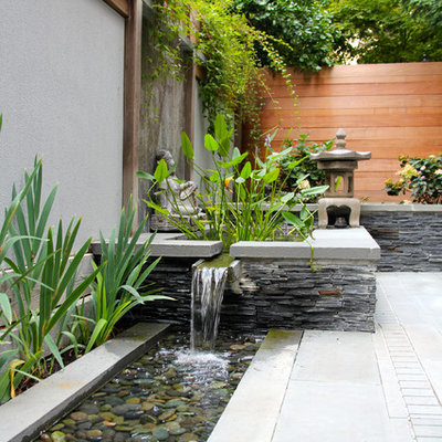 Example of a small courtyard stone patio fountain design in DC Metro with no cover