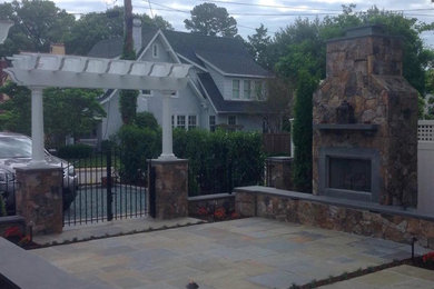 Mid-sized arts and crafts front yard stone patio photo in Richmond with a fire pit and no cover