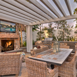 Patio - transitional patio idea in Orange County with a fire pit and a pergola