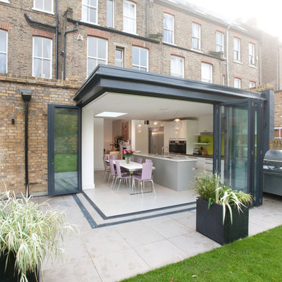 Example of a mid-sized trendy patio design in London