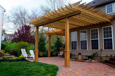 Inspiration for a large backyard patio remodel in Atlanta with an awning