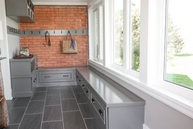 Photo of a medium sized farmhouse side patio in Toronto with tiled flooring and a roof extension.