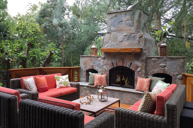 Inspiration for a mid-sized rustic backyard patio remodel in Los Angeles with a fire pit, decking and no cover