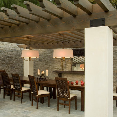 Tuscan patio photo in Los Angeles with a pergola