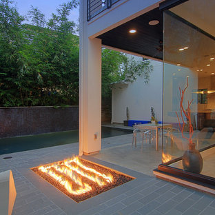 Inspiration for a contemporary patio remodel in Houston with a fire pit