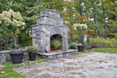 Patio - mid-sized traditional backyard concrete patio idea in Boston with a fire pit and no cover
