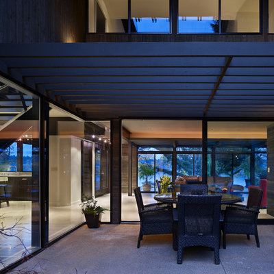 Inspiration for a contemporary patio remodel in Seattle with a pergola