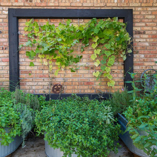 Ispirazione per un patio o portico boho chic nel cortile laterale con cemento stampato