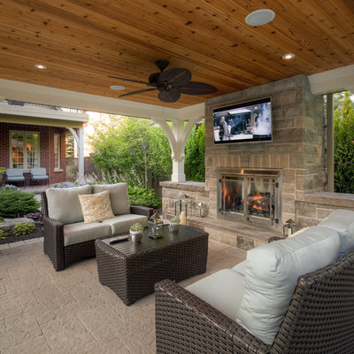 Patio - large traditional backyard stone patio idea in Toronto with a gazebo