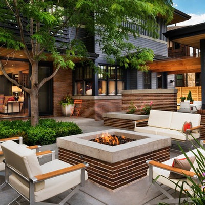 Patio - mid-sized contemporary backyard concrete patio idea in Denver with a fire pit and no cover