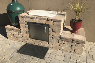 Patio kitchen - small traditional backyard concrete paver patio kitchen idea in Other with no cover