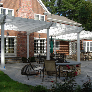 Large attached cellular PVC pergola with canopy