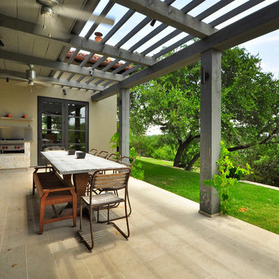 Example of a trendy patio design in Austin with a pergola