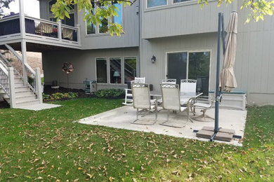 Example of a mid-sized trendy backyard patio design in Kansas City