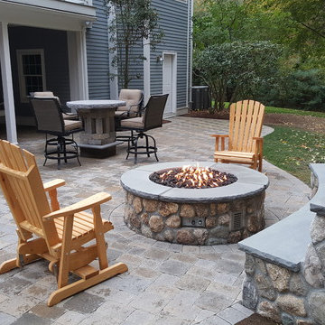 Lexington Custom firepit, stone seating bench, and paver patio